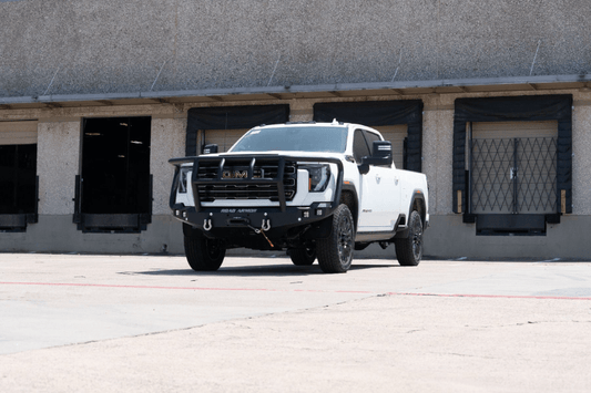 Road Armor Stealth 2242F2B Front Bumper with Titan II Guard installed on a 2024-2026 GMC Sierra 2500 HD, featuring textured black finish, winch compatibility, and aggressive off-road styling.