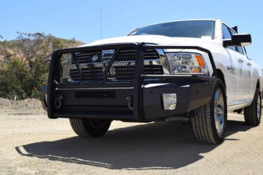 White truck with Steelcraft Elevation Front Bumper with Grille Guard for 2013-2018 Dodge Ram 1500, heavy-duty black plate steel on a road with trees and blue sky in the background