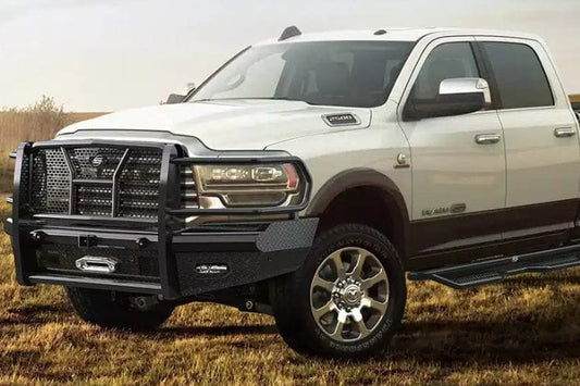 White Ford truck with Steelcraft HD Replacement Front Bumper for 2019-2026 Dodge Ram 2500 and 3500, winch ready with 2-inch receiver hitch, black pipe steel in a field