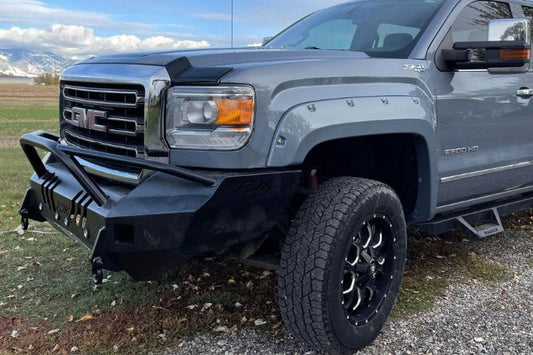 Throttle Down Kustoms Front Bumper with Pre-Runner Bar for 2015-2018 GMC Sierra 2500 and 3500, steel replacement bumper on a gravel road