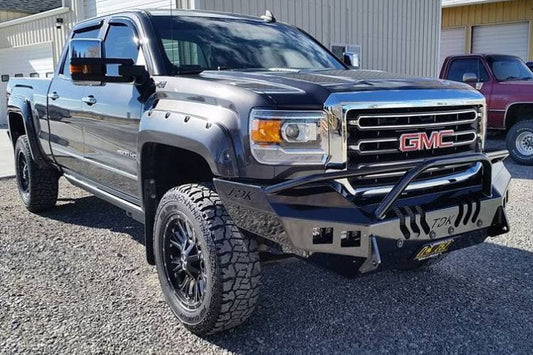 Throttle Down Kustoms Front Bumper with Pre-Runner Bar for 2015-2018 GMC Sierra 2500 and 3500, steel replacement bumper parked on a gravel surface with a building in the background