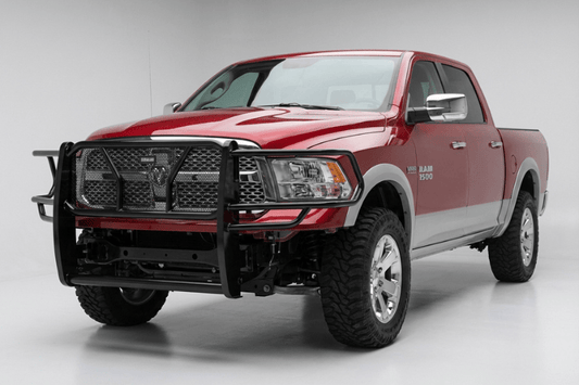 TrailFX FX3012 full replacement front bumper for 2009-2012 Dodge Ram 1500, featuring a heavy-duty steel grille guard and textured black powder-coat finish.