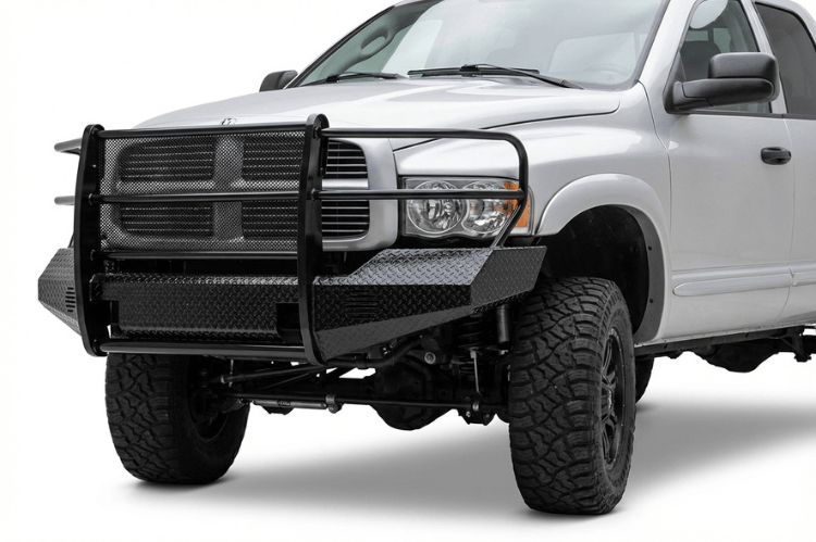 TrailFX FX3010 full replacement front bumper for 2003-2005 Dodge Ram 2500 and 3500, featuring a heavy-duty steel grille guard and textured black powder-coat finish.