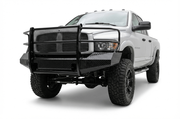 TrailFX FX3010 full replacement front bumper for 2003-2005 Dodge Ram 2500 and 3500, featuring a heavy-duty steel grille guard and textured black powder-coat finish.