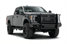 TrailFX FX3023 full replacement front bumper for 2017-2022 Ford F250 and F350 Super Duty trucks, featuring a heavy-duty grille guard and black powder-coated finish.