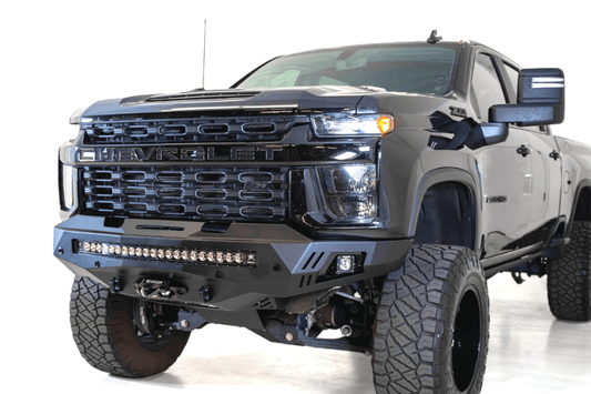 Black truck front end showcasing ADD F271202890103 Stealth Fighter bumper, designed for Chevy Silverado 2500/3500, winch-ready with sensors