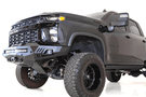 Black truck front end showcasing ADD F271202890103 Stealth Fighter bumper, designed for Chevy Silverado 2500/3500 2020-2023, winch-ready with sensors