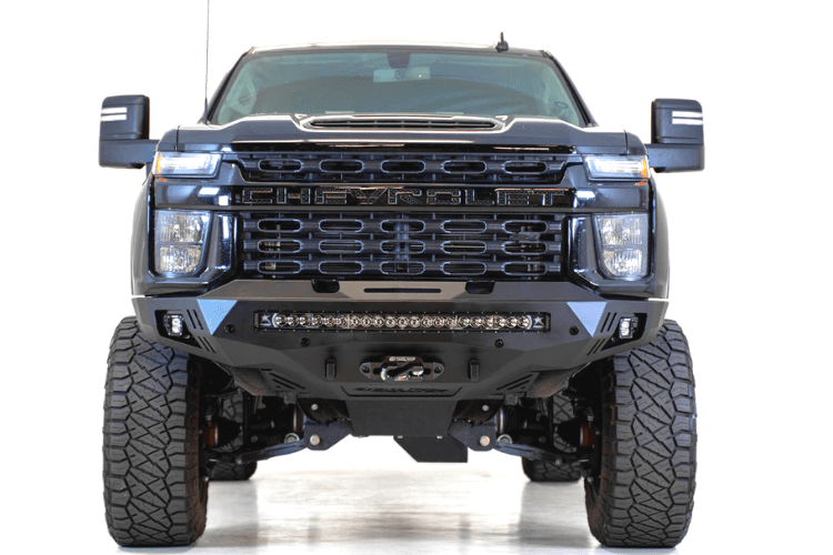 Black truck front end showcasing ADD F271202890103 Stealth Fighter bumper, designed for Chevy Silverado 2500/3500 2020-2023, winch-ready with sensors