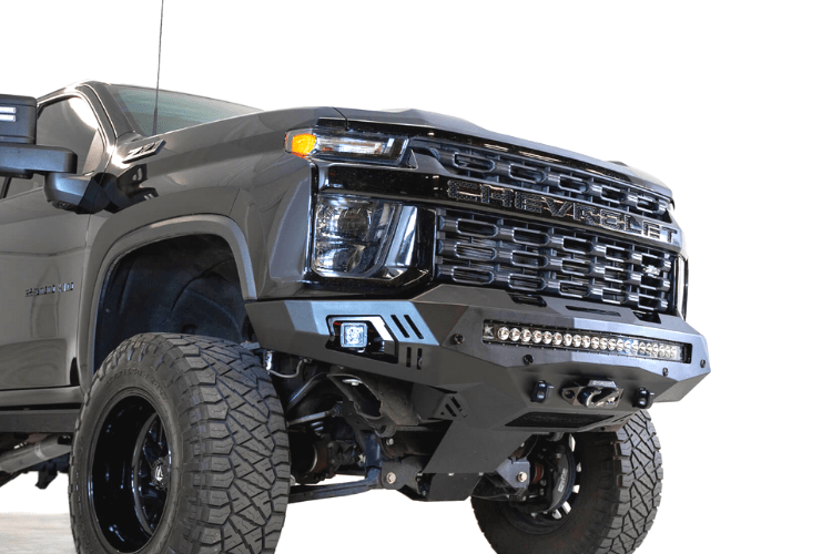 Black truck front end showcasing ADD F271202890103 Stealth Fighter bumper, designed for Chevy Silverado 2500/3500 2020-2023, winch-ready with sensors