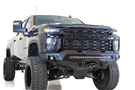 Black truck front end showcasing ADD F271202890103 Stealth Fighter bumper, designed for Chevy Silverado 2500/3500 2020-2023, winch-ready with sensors