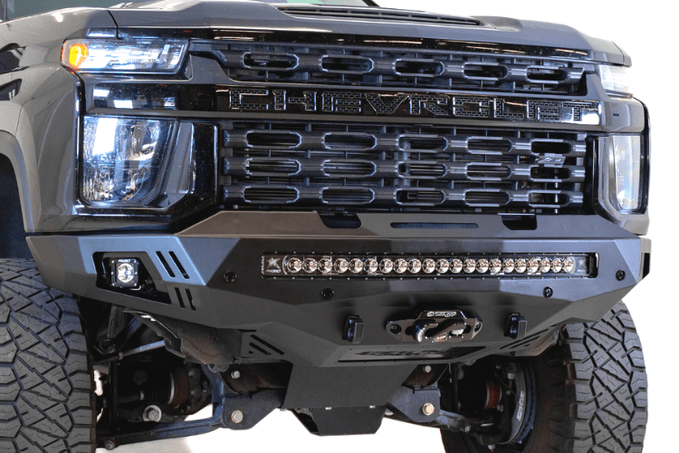 Black truck front end showcasing ADD F271202890103 Stealth Fighter bumper, designed for Chevy Silverado 2500/3500 2020-2023, winch-ready with sensors