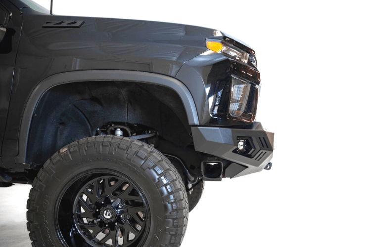 Black truck front end showcasing ADD F271202890103 Stealth Fighter bumper, designed for Chevy Silverado 2500/3500 2020-2023, winch-ready with sensors