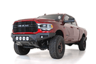 Front view of a red Ram truck featuring the ADD F560014110103 Bomber Black front bumper for Dodge Ram 2500/3500 models