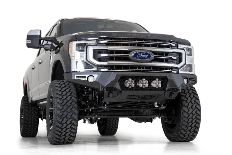 Black Ford truck's front end showcasing an ADD Bomber Black bumper F160014100103, tailored for 2017-2022 F250/F350 Superduty vehicles