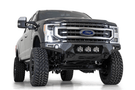 Black Ford truck's front end showcasing an ADD Bomber Black bumper F160014100103, tailored for 2017-2022 F250/F350 Superduty vehicles
