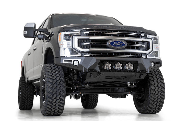 Black Ford truck's front end showcasing an ADD Bomber Black bumper F160014100103, tailored for 2017-2022 F250/F350 Superduty vehicles
