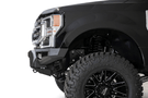Black Ford truck's front end showcasing an ADD Bomber Black bumper F160014100103, tailored for 2017-2022 F250/F350 Superduty vehicles