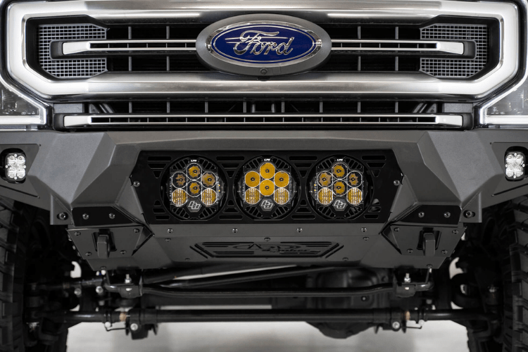 Black Ford truck's front end showcasing an ADD Bomber Black bumper F160014100103, tailored for 2017-2022 F250/F350 Superduty vehicles