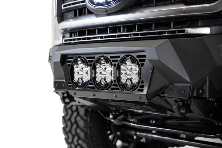 Black Ford truck's front end showcasing an ADD Bomber Black bumper F160014100103, tailored for 2017-2022 F250/F350 Superduty vehicles