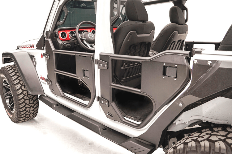 Open doors of a Jeep Wrangler JL 2018-2024, showcasing the Fab Fours JL1032-1 Half Front Tube Door design