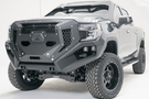 Fab Fours GR3900-1 Grumper front bumper on 2019–2022 GMC Sierra 1500, winch-ready with integrated sensor holes and aggressive grille design