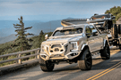 Fab Fours GR4100-1 Grumper front bumper for 2017-2022 Ford F250/F350 Superduty, winch ready with integrated sensor holes and aggressive off-road design.