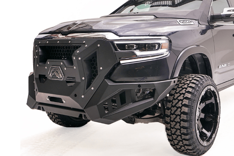 Fab Fours GR4200-1 Grumper front bumper on 2019–2024 Dodge Ram 1500, aggressive full-width design with integrated grille and off-road protection