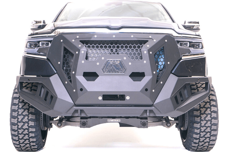 Fab Fours GR4200-1 Grumper front bumper on 2019–2024 Dodge Ram 1500, aggressive full-width design with integrated grille and off-road protection
