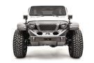 Fab Fours GR4650-1 Grumper stubby front bumper on Jeep Wrangler JL 2018–2024, aggressive off-road design with integrated grille and compact protection
