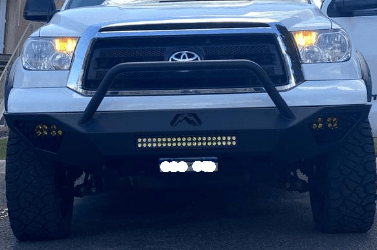 Fab Fours TT07-D4452-1 Vengeance pre-runner style front bumper for 2007–2013 Toyota Tundra, aggressive off-road design with sleek black finish.