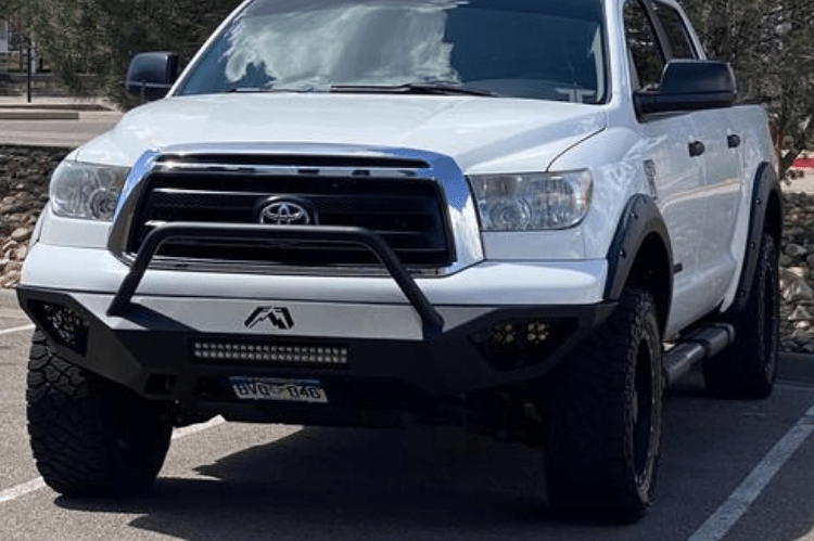 Fab Fours TT07-D4452-1 Vengeance pre-runner style front bumper for 2007–2013 Toyota Tundra, aggressive off-road design with sleek black finish.