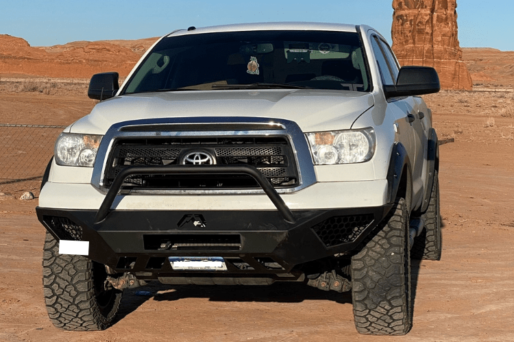 Fab Fours TT07-D4452-1 Vengeance pre-runner style front bumper for 2007–2013 Toyota Tundra, aggressive off-road design with sleek black finish.